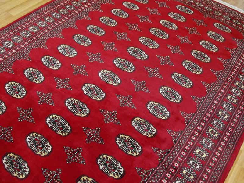 A red Bokhara-style Oriental rug