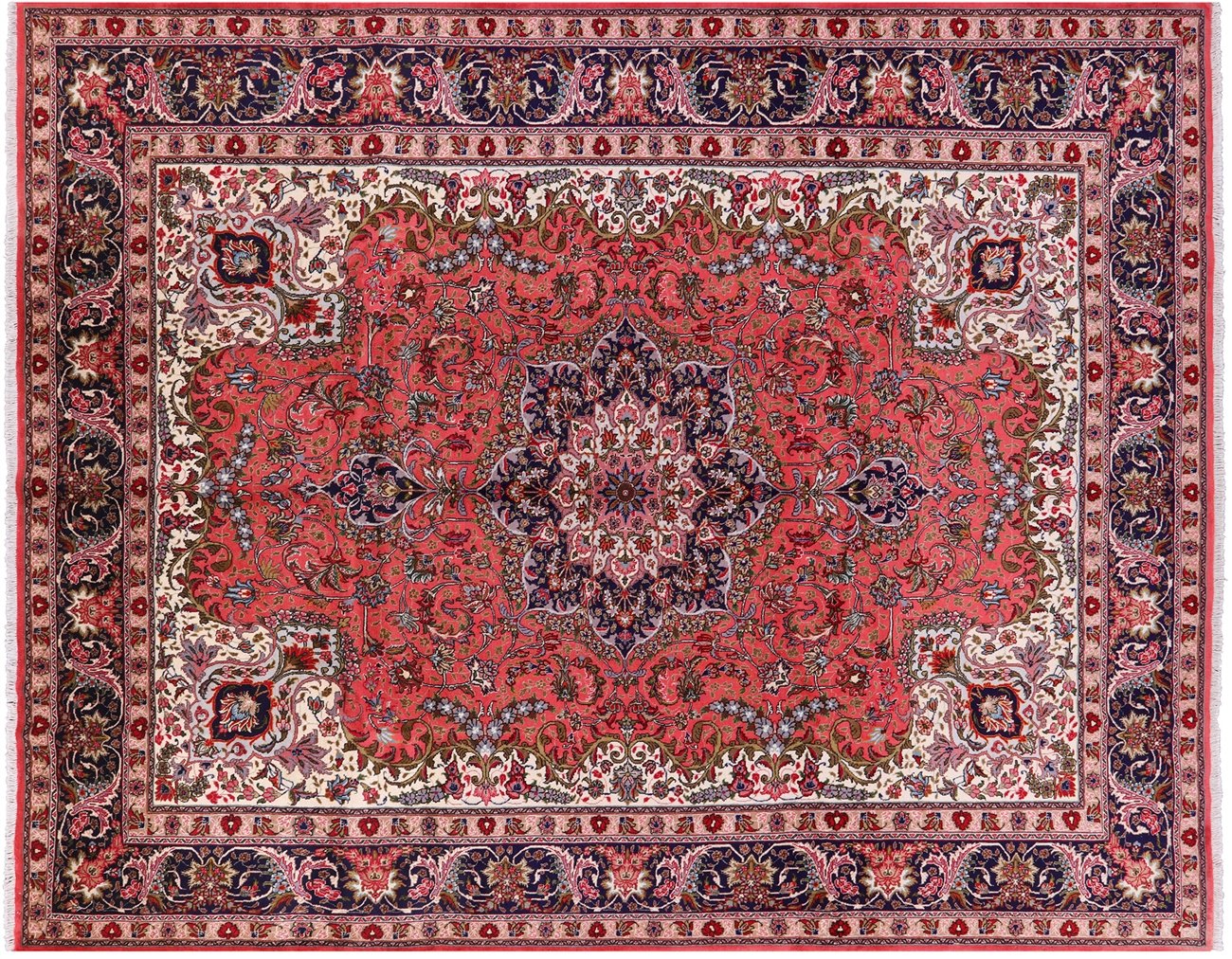 A red Tabriz-style Persian rug with a central medallion